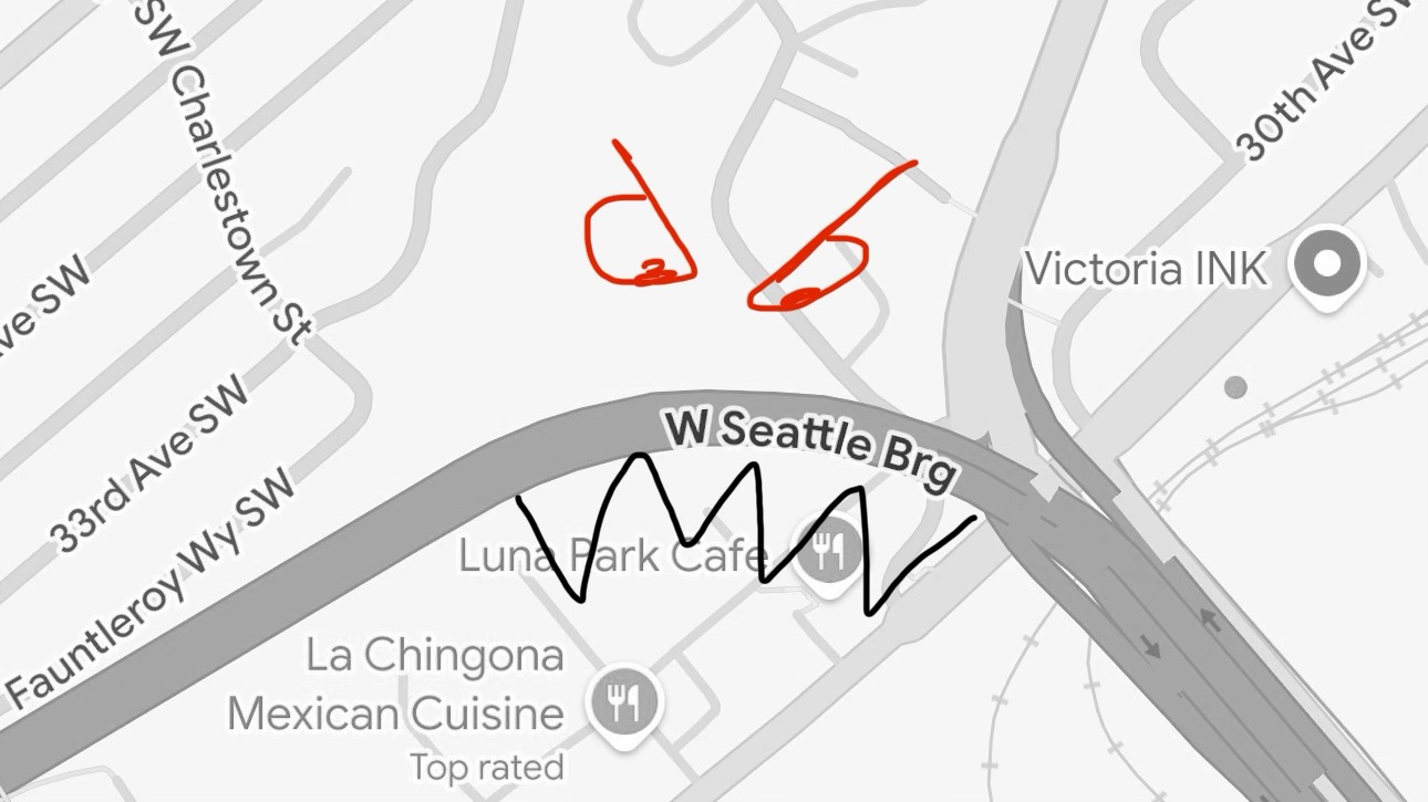 Simple map showing a curving main road with hand-sketched angry eyes and sharp teeth over it